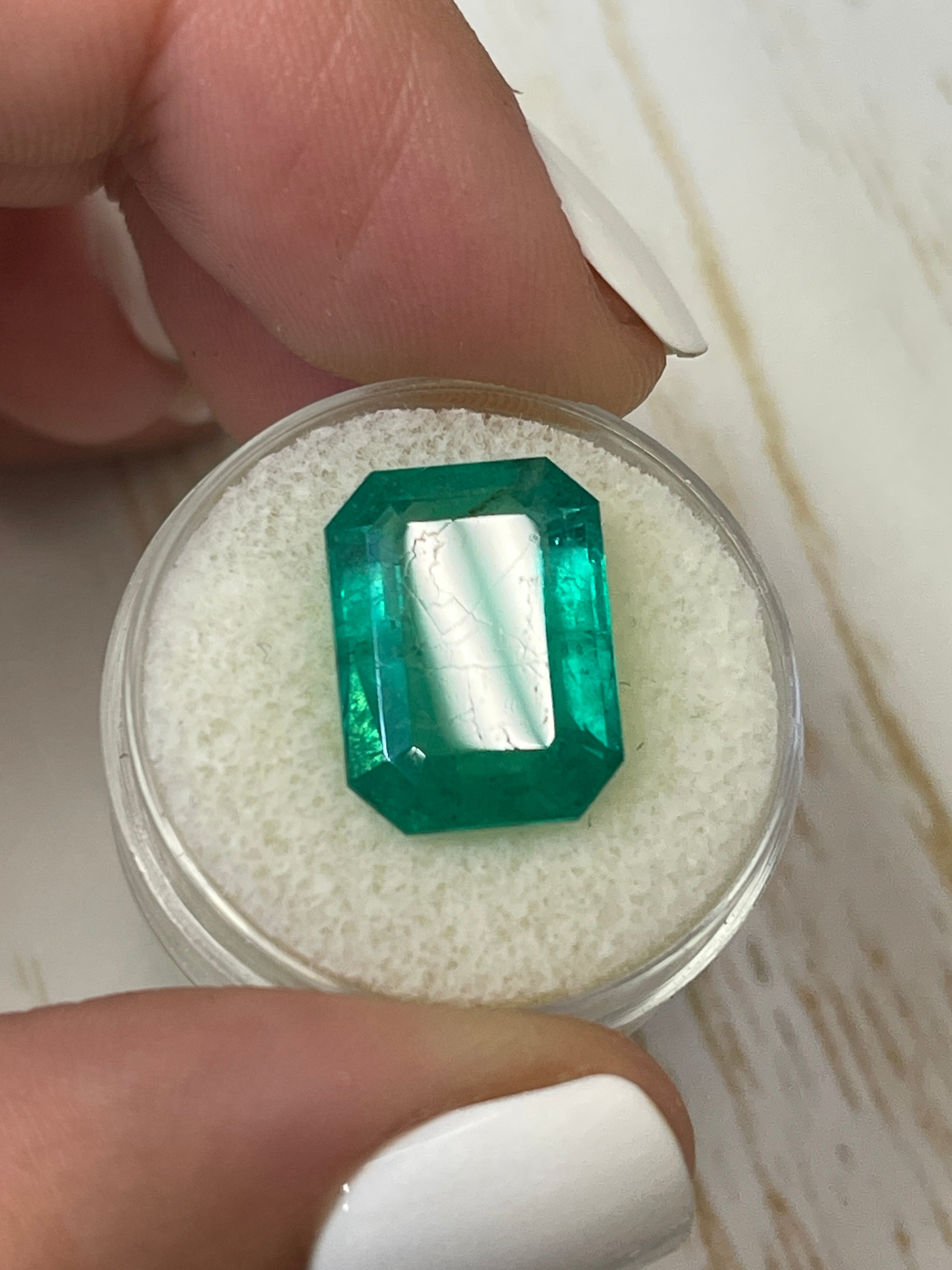 Large 9.52-carat natural Colombian emerald in an emerald cut, showcasing vibrant green color and clarity.