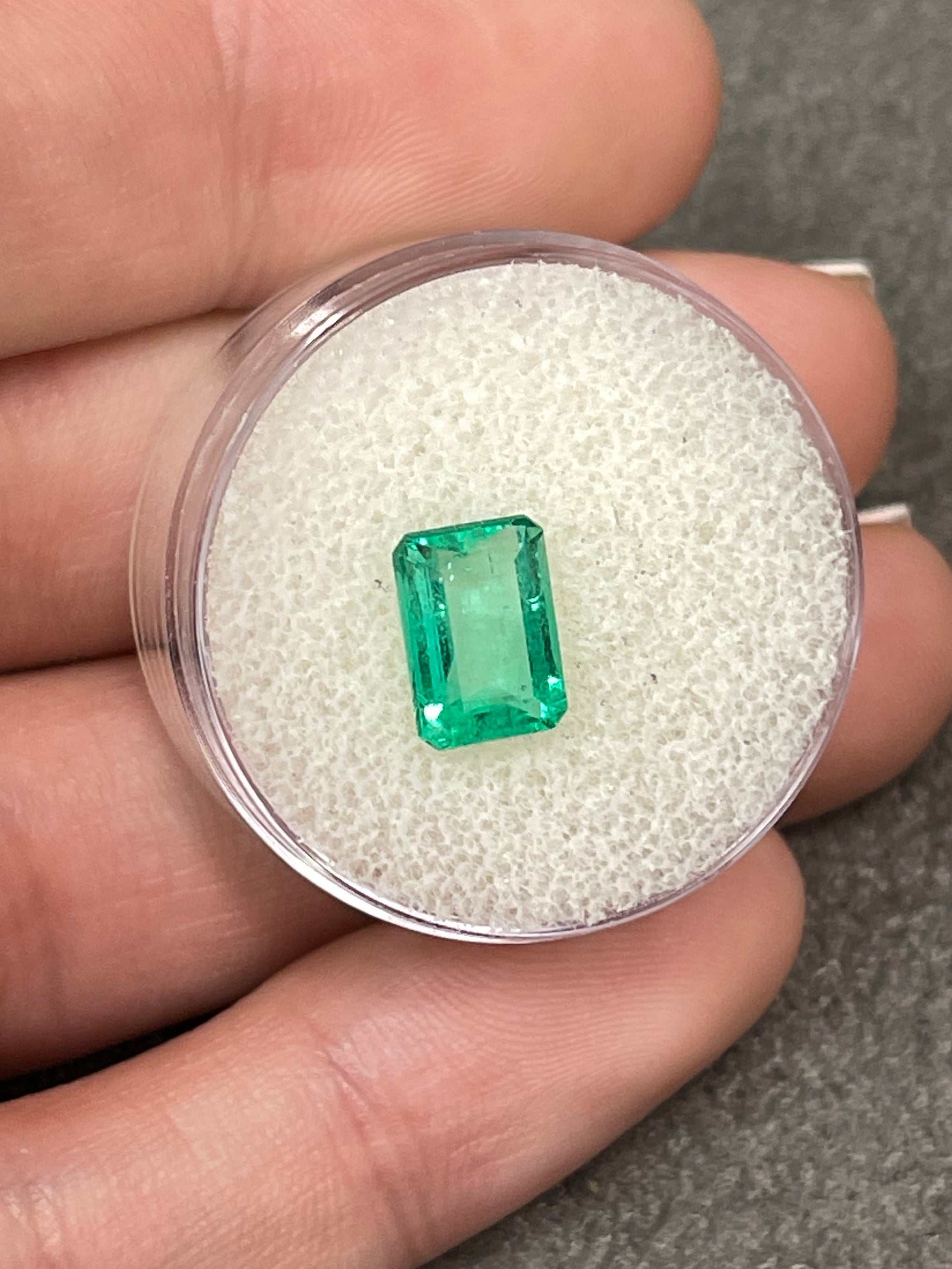 1.50 carat chromatic green natural Colombian emerald loose stone with emerald cut, from JR Colombian Emeralds.
