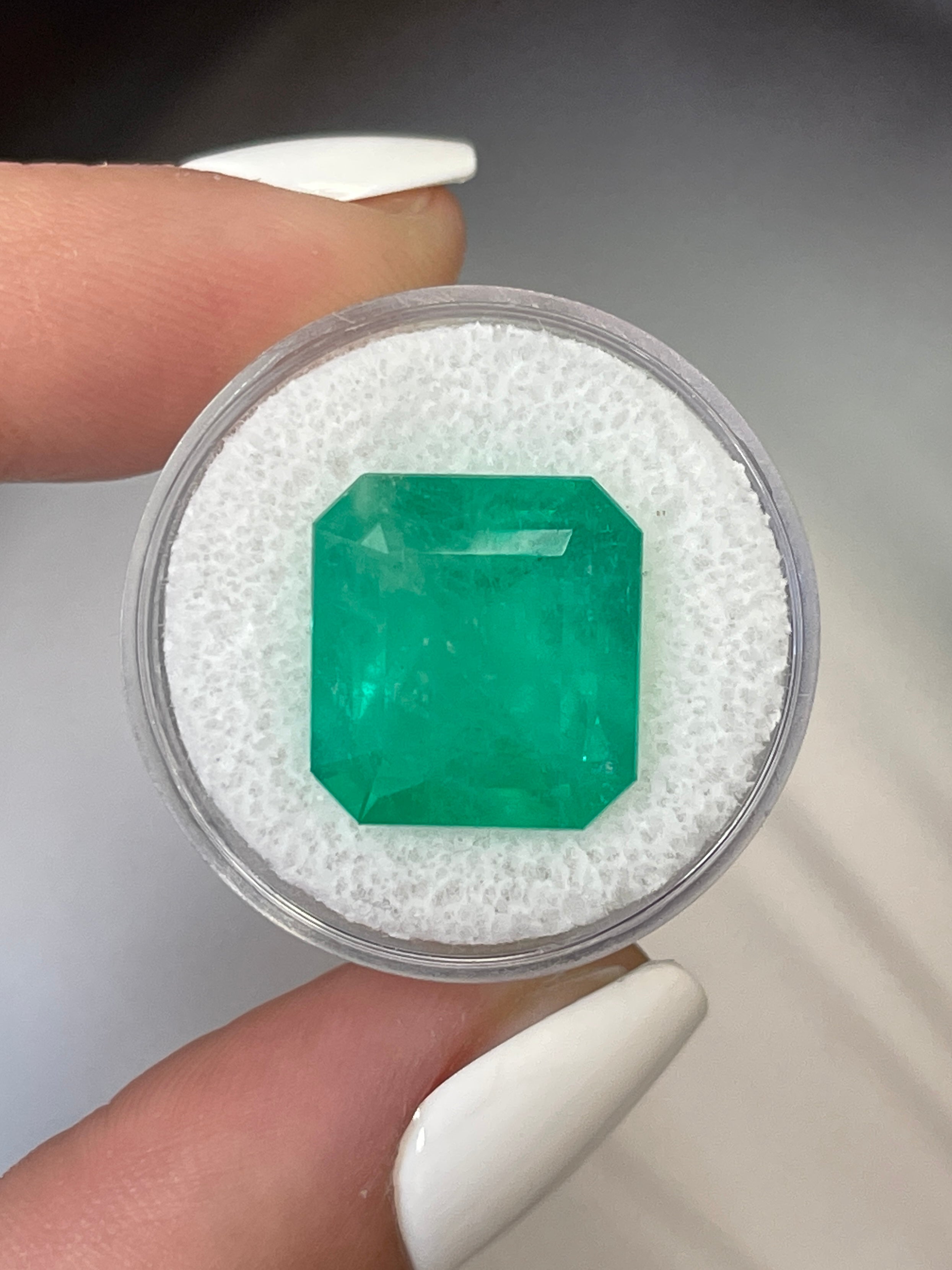Large 12.09 carat Colombian emerald in 15x14mm Asscher cut, loose gemstone from JR Colombian Emeralds.