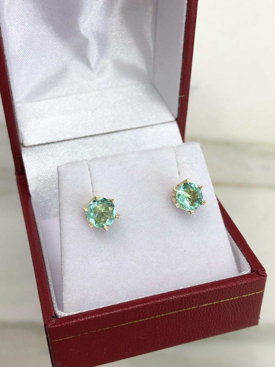 JR Colombian Emeralds 14K gold earrings with 1.56tcw round rich green emeralds in six-prong setting.