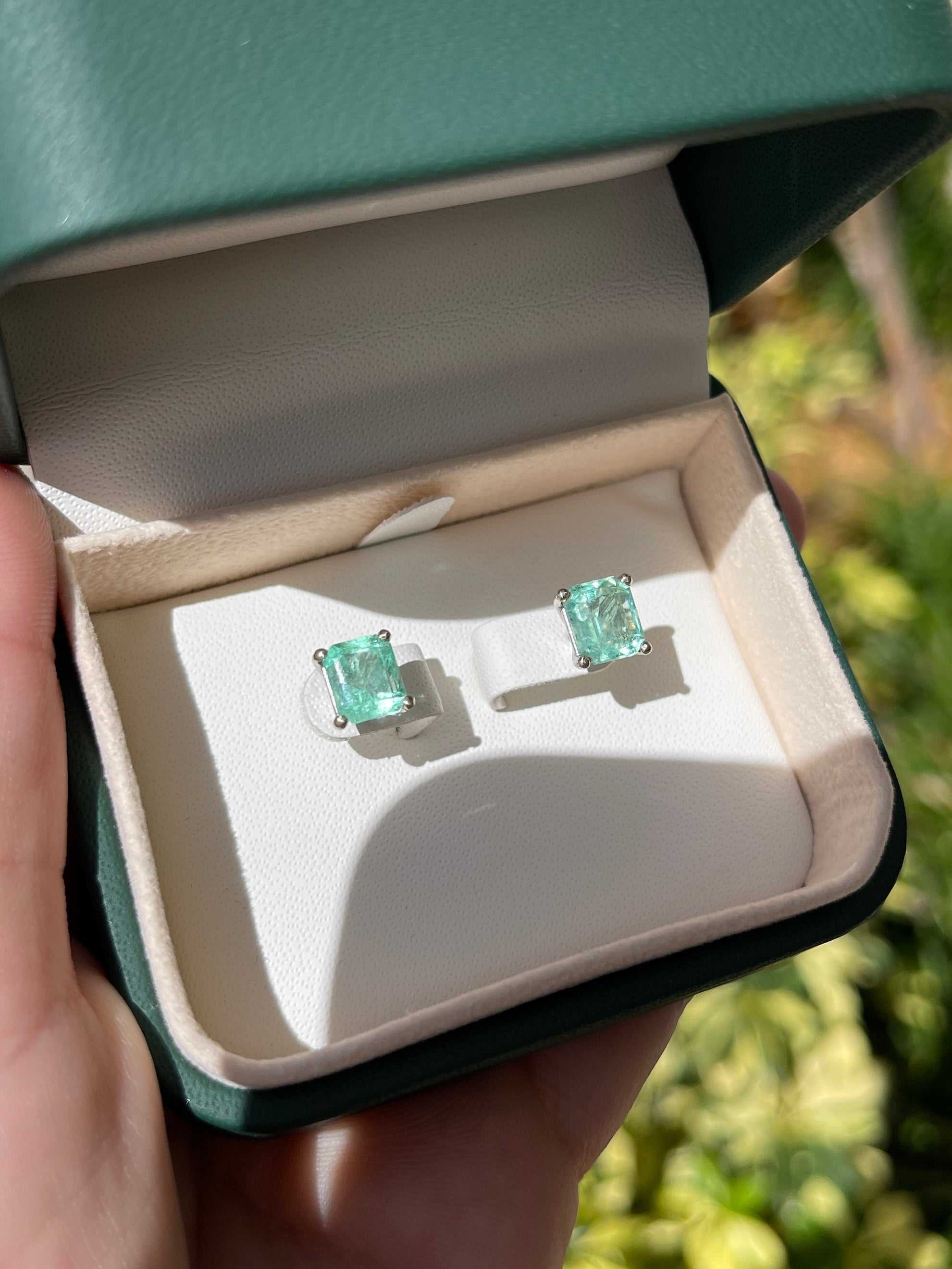 18K white gold light green Colombian emerald stud earrings with 3.46tcw, featuring elegant martini cut gemstones from JR Colombian Emeralds.