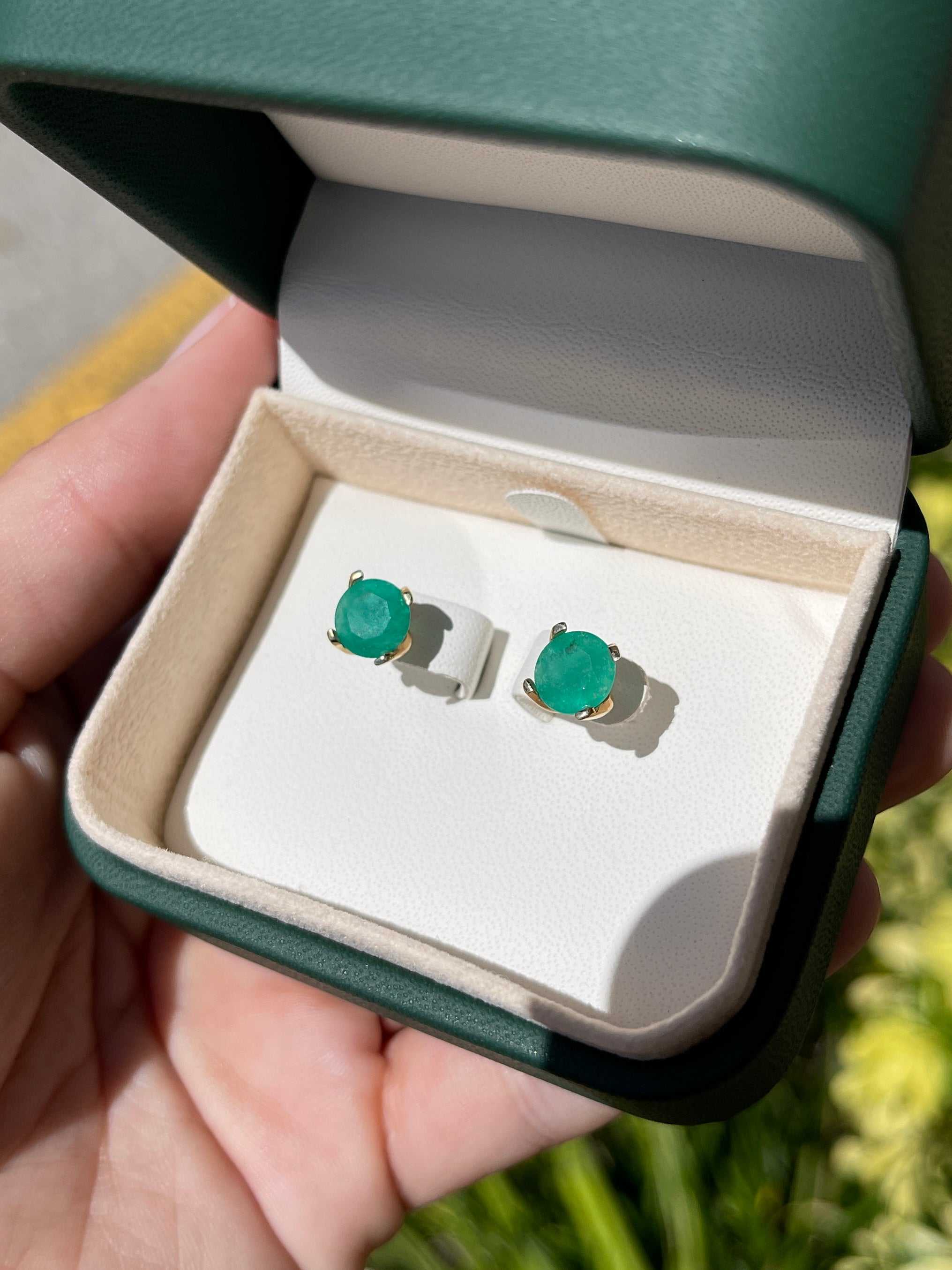 14K gold emerald stud earrings with round, classic basket setting featuring 3.75 carats of vibrant green Colombian emeralds.
