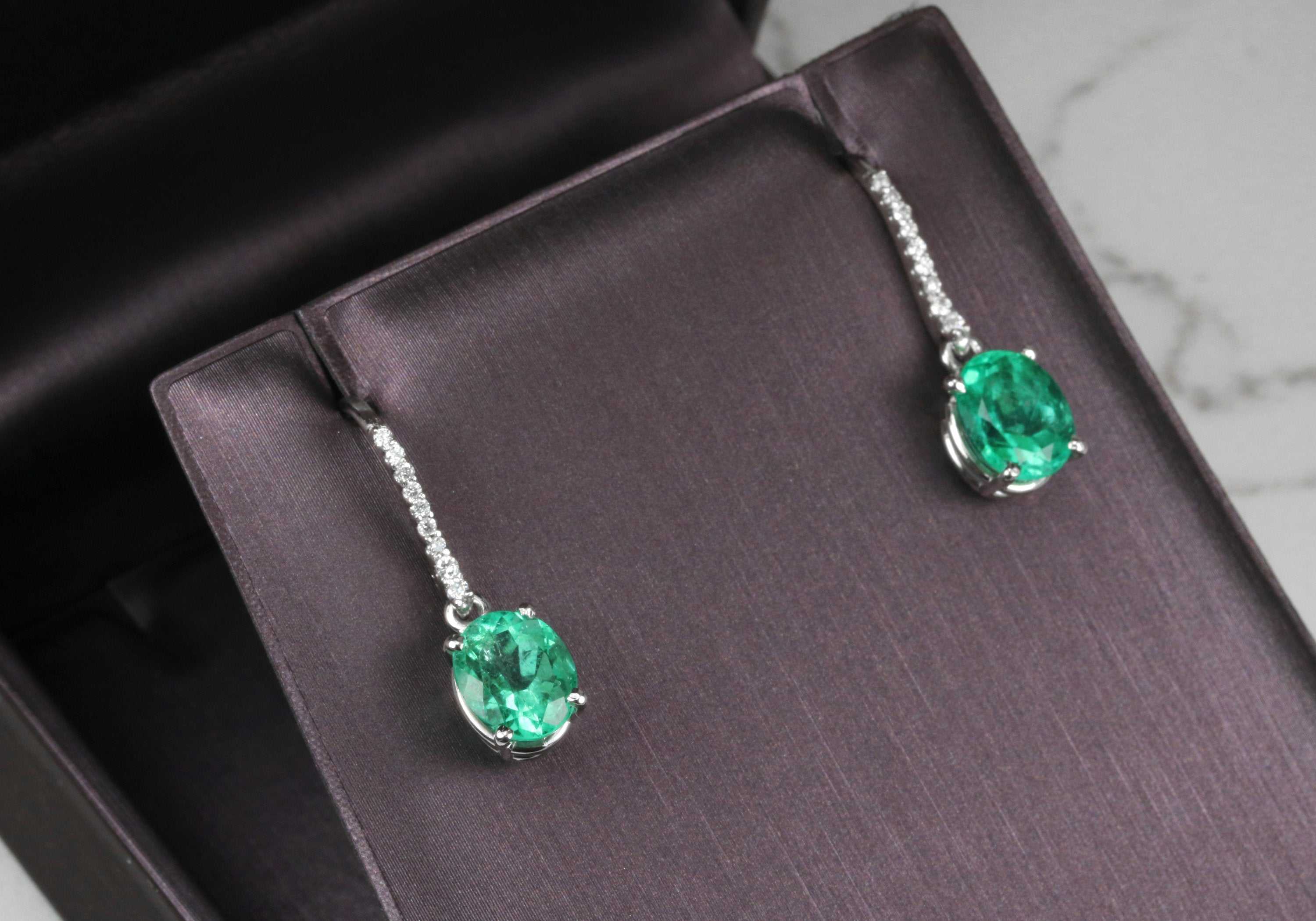 Fine quality vivid green Colombian emerald oval and diamond dangle earrings in 14K gold by JR Colombian Emeralds