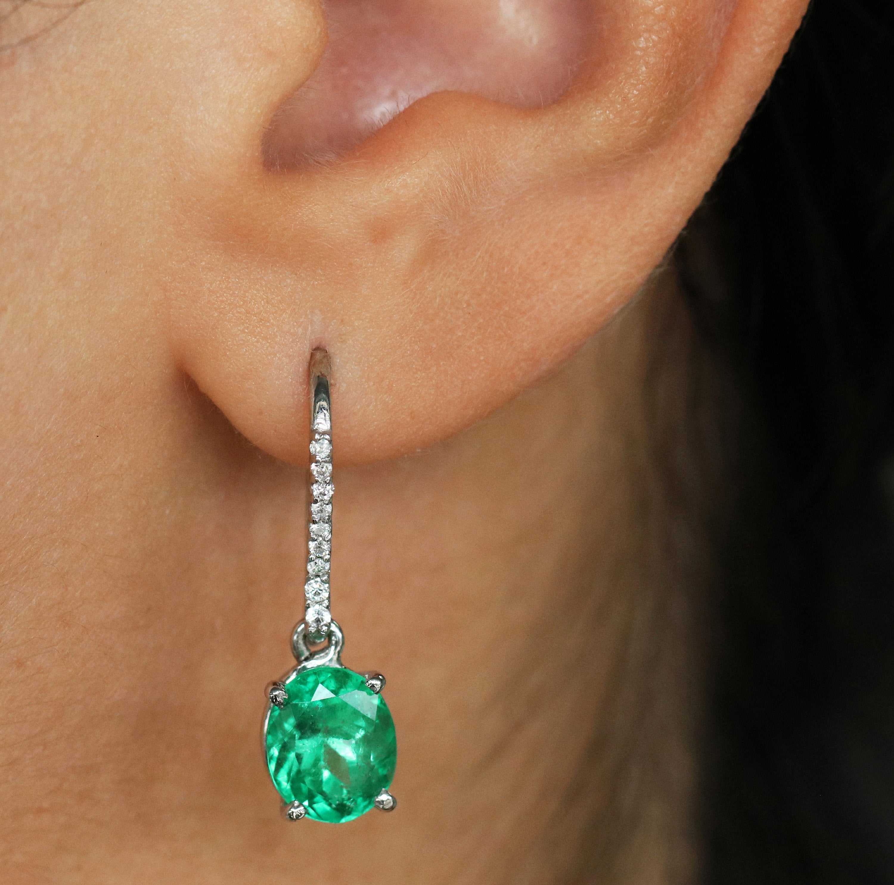 Fine-quality vivid green Colombian emerald oval and diamond dangle earrings in 14K gold by JR Colombian Emeralds.