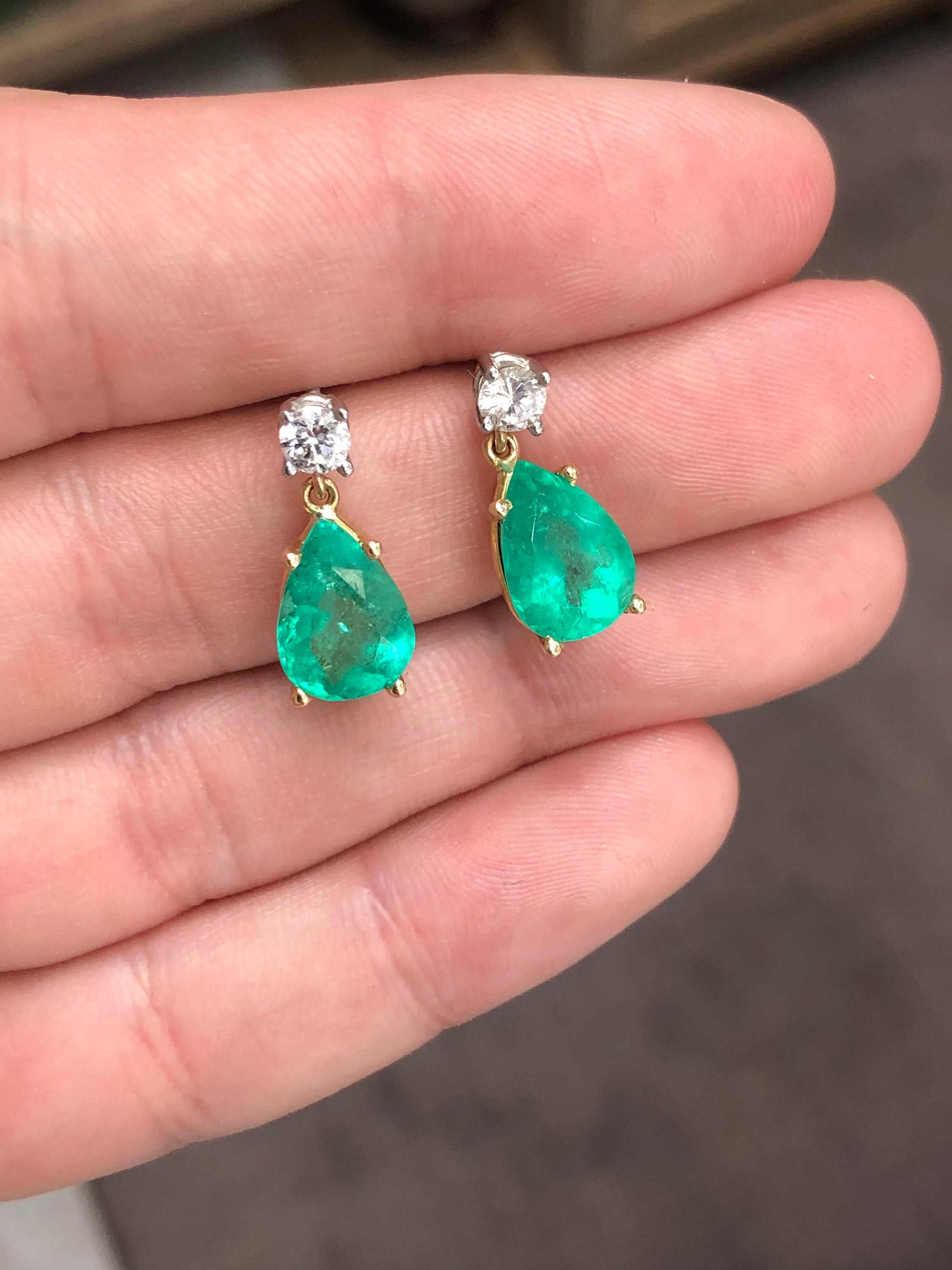 Natural tear drop emerald and diamond dangle earrings in 14K gold by JR Colombian Emeralds, showcasing sparkling gemstones.