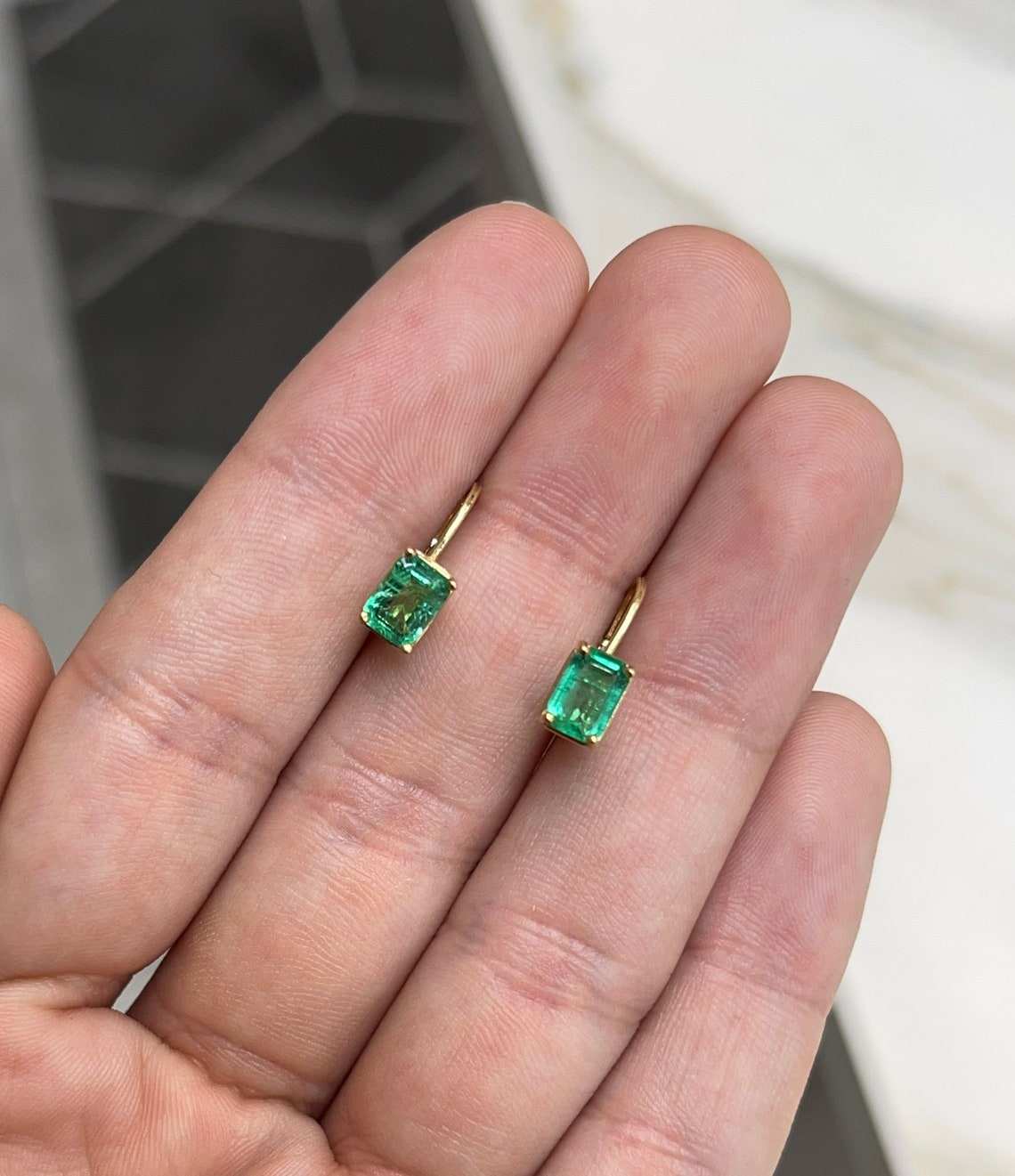 JR Colombian Emeralds 14K yellow gold earrings with 1.50tcw natural emerald cut emeralds in prong-set lever back style