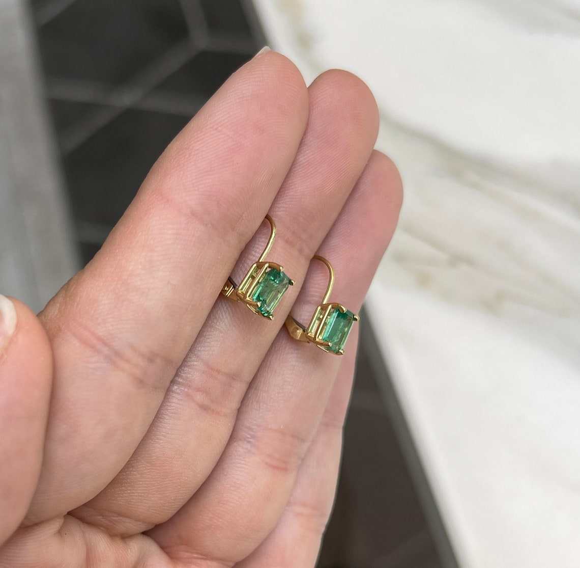 JR Colombian Emeralds 14K yellow gold earrings with 1.50tcw natural emerald cut emeralds, prong set with lever back closure