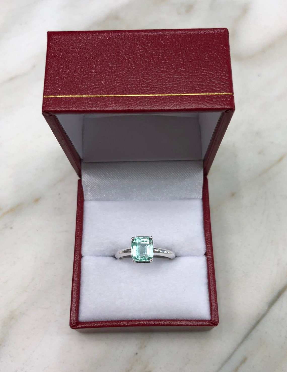 1.50 Carats Emerald Cut Emerald Solitaire Straight Shank Engagement Ring
