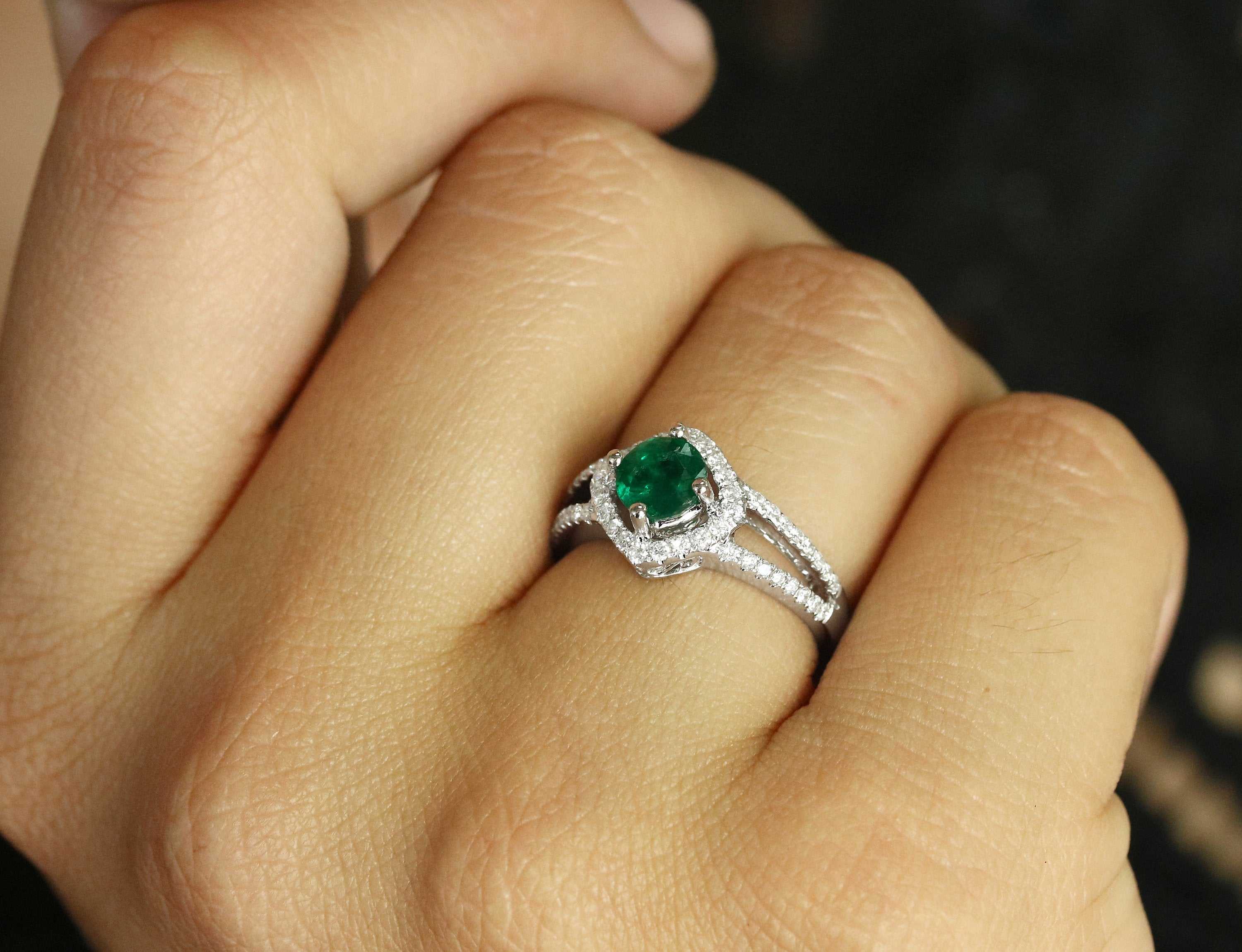 Emerald and diamond halo engagement ring with split shank design by JR Colombian Emeralds, featuring 1.39tcw gemstones.