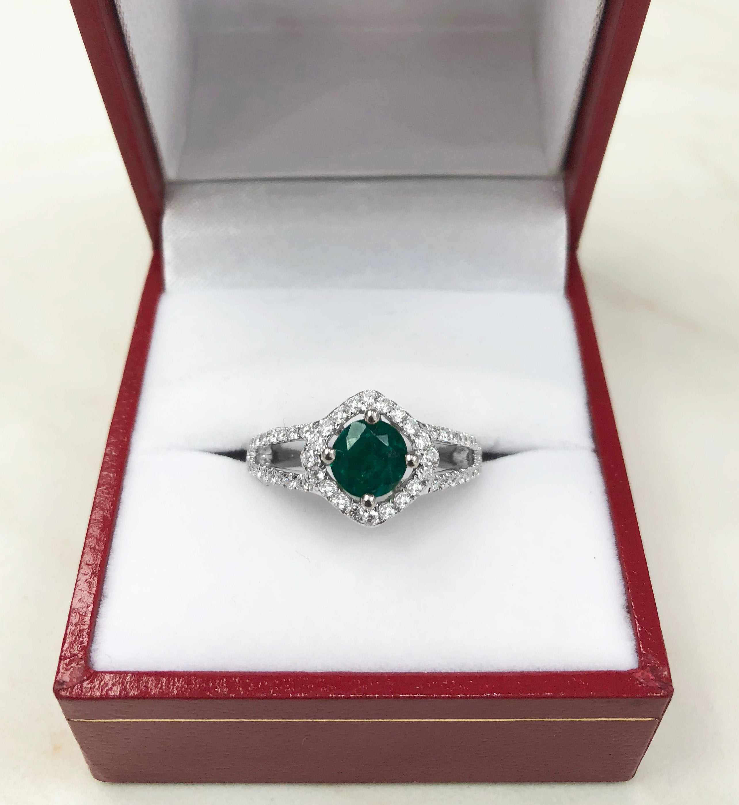 Emerald and diamond halo engagement ring with split shank design by JR Colombian Emeralds, featuring a 1.39tcw center stone.