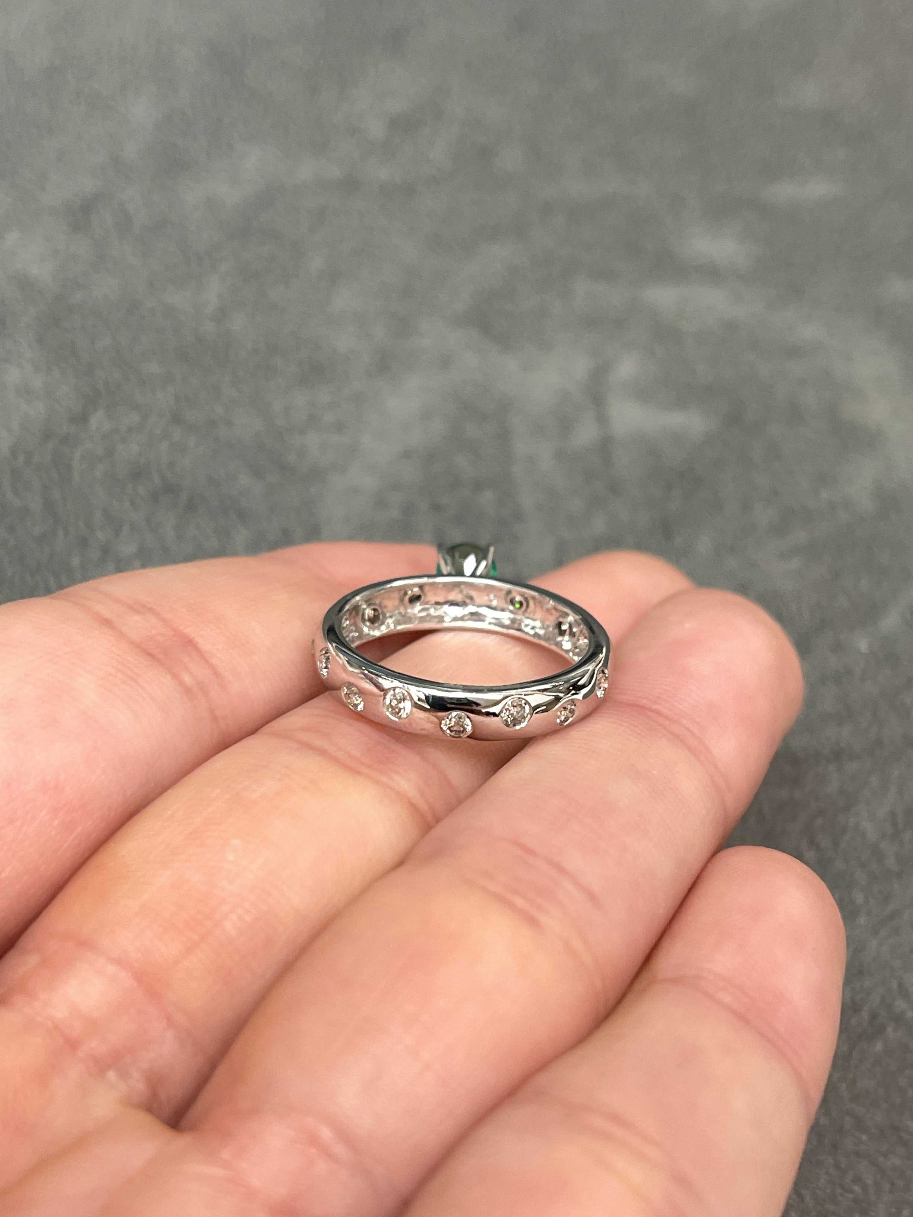 Celebrate Brilliance: 14K Gold Ring Featuring 1.15tcw Round Colombian Emerald & Diamond Eternity Band