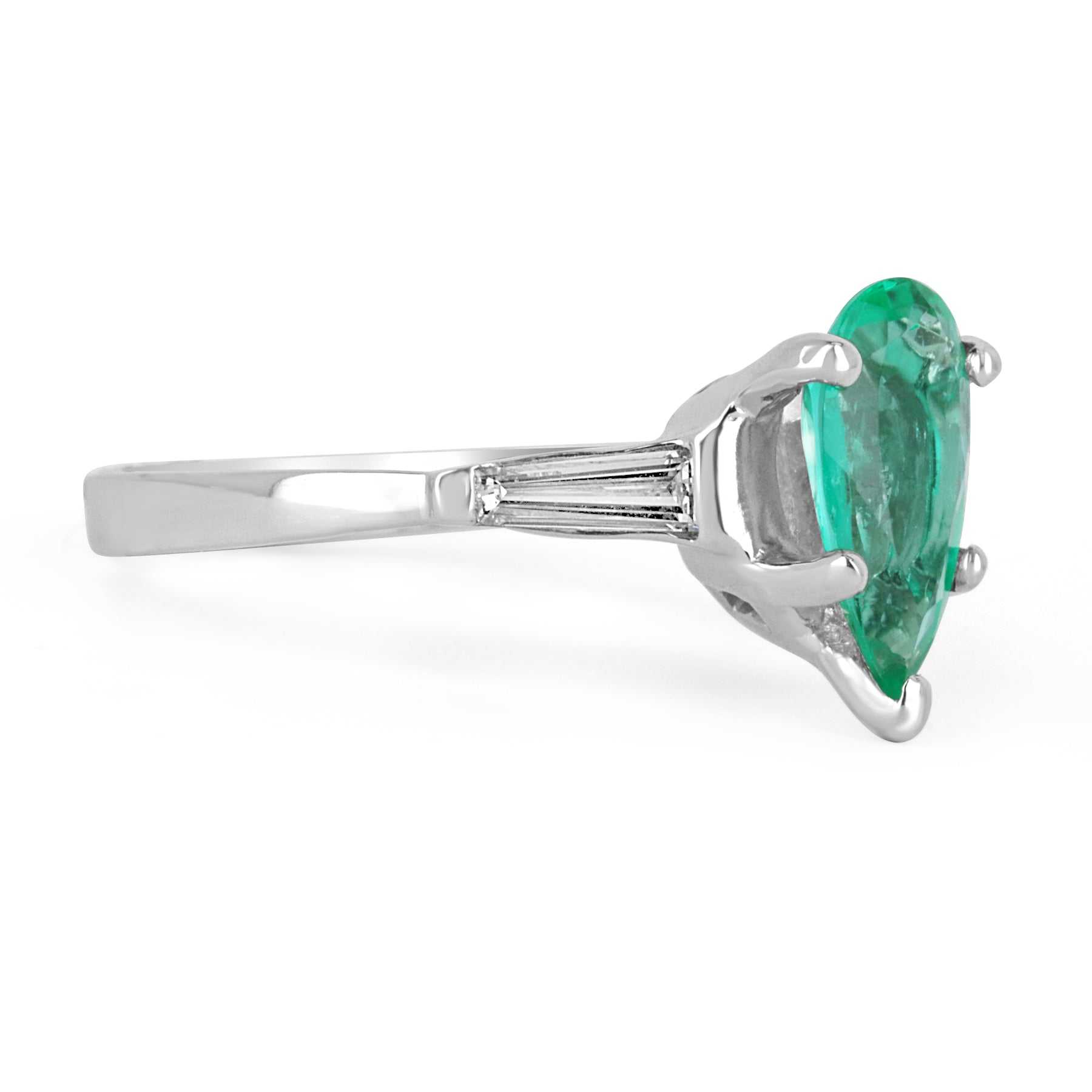 Brilliant pear-cut Colombian emerald and tapered baguette diamond engagement ring in 18K gold by JR Colombian Emeralds.