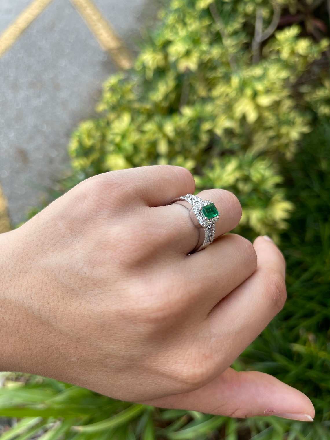 Natural green emerald engagement ring with round and baguette diamonds in 14K gold by JR Colombian Emeralds.