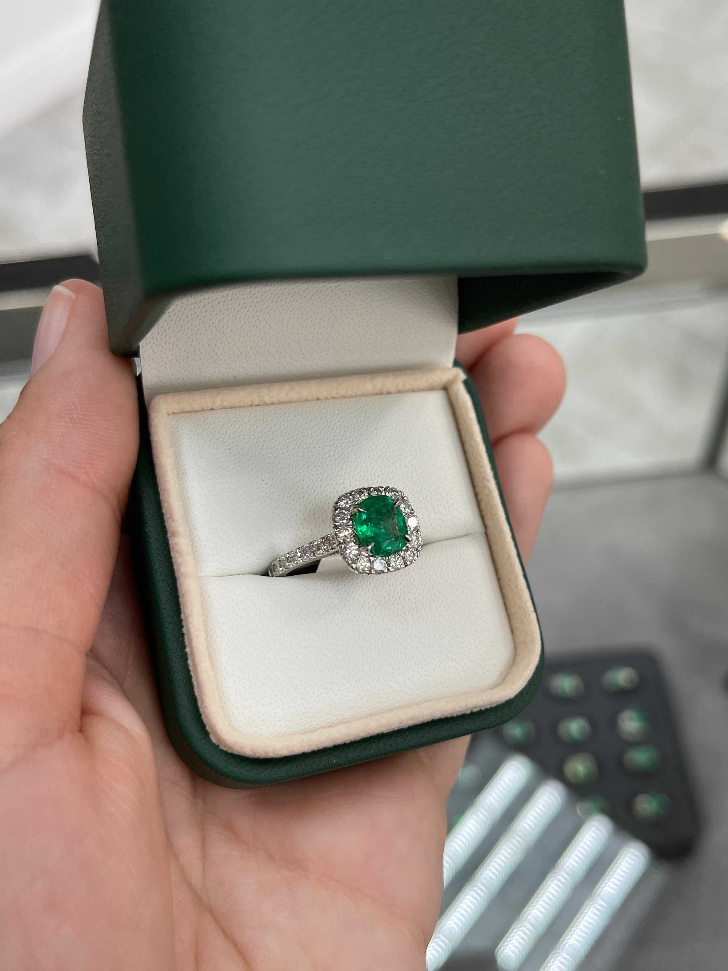 Natural emerald and diamond halo engagement ring in 14K gold, featuring a 2.31tcw emerald center stone and intricate detailing.