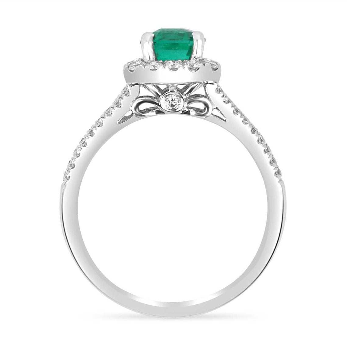 Asscher cut Colombian emerald diamond halo engagement ring in 14K white gold, featuring a 3.90 carat emerald and diamond accents.