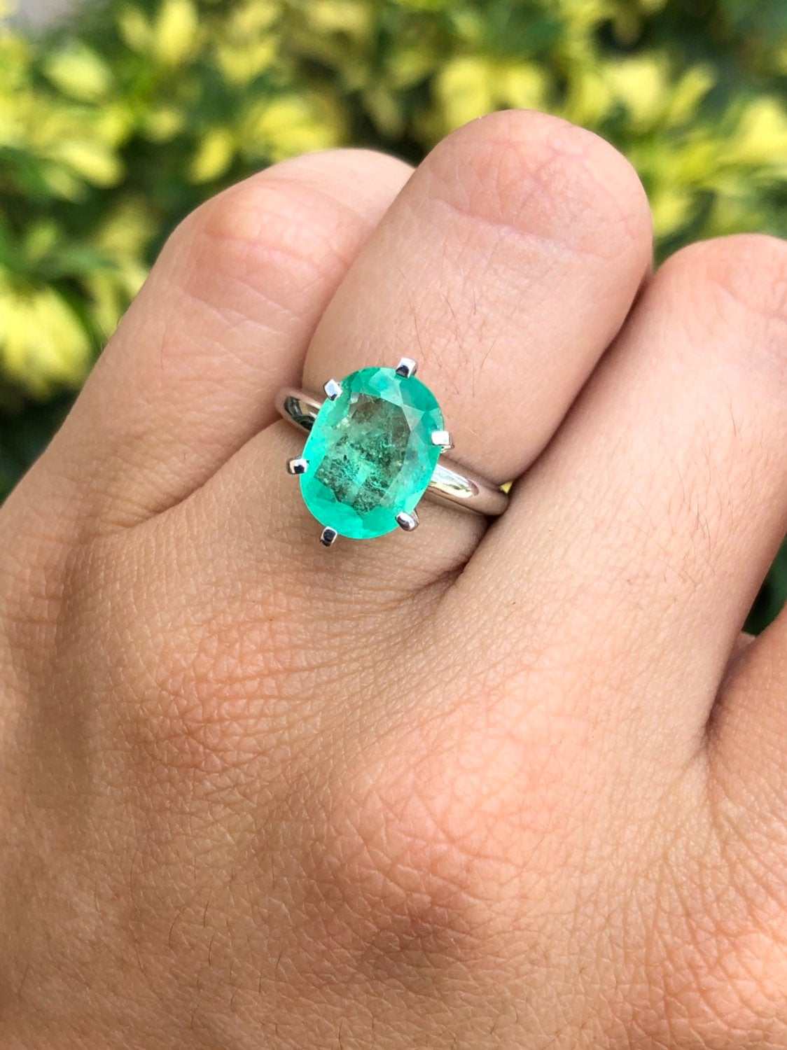 14K gold engagement ring with 3.20ct oval-cut Colombian emerald solitaire, showcasing elegant jewelry design.