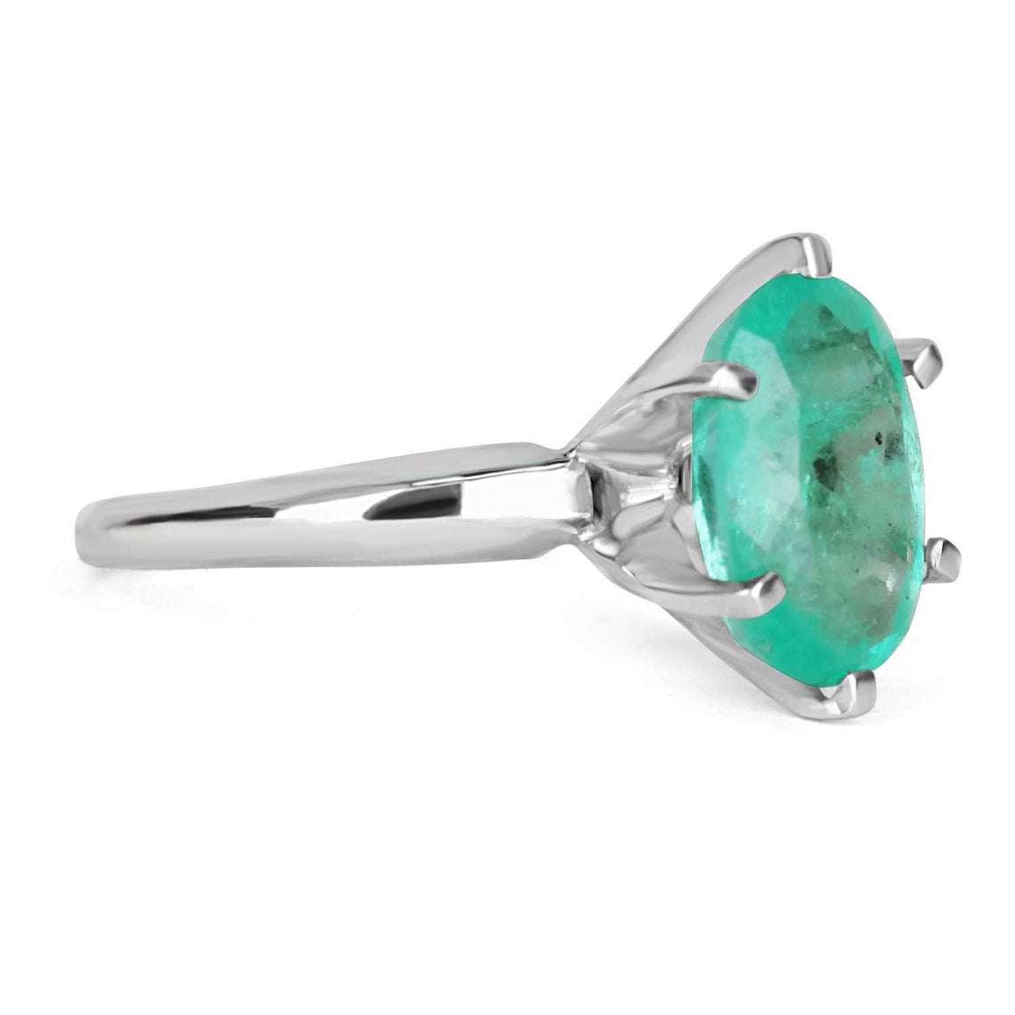 14K gold engagement ring with 3.20ct oval cut Colombian emerald solitaire, showcasing a vibrant green gemstone.