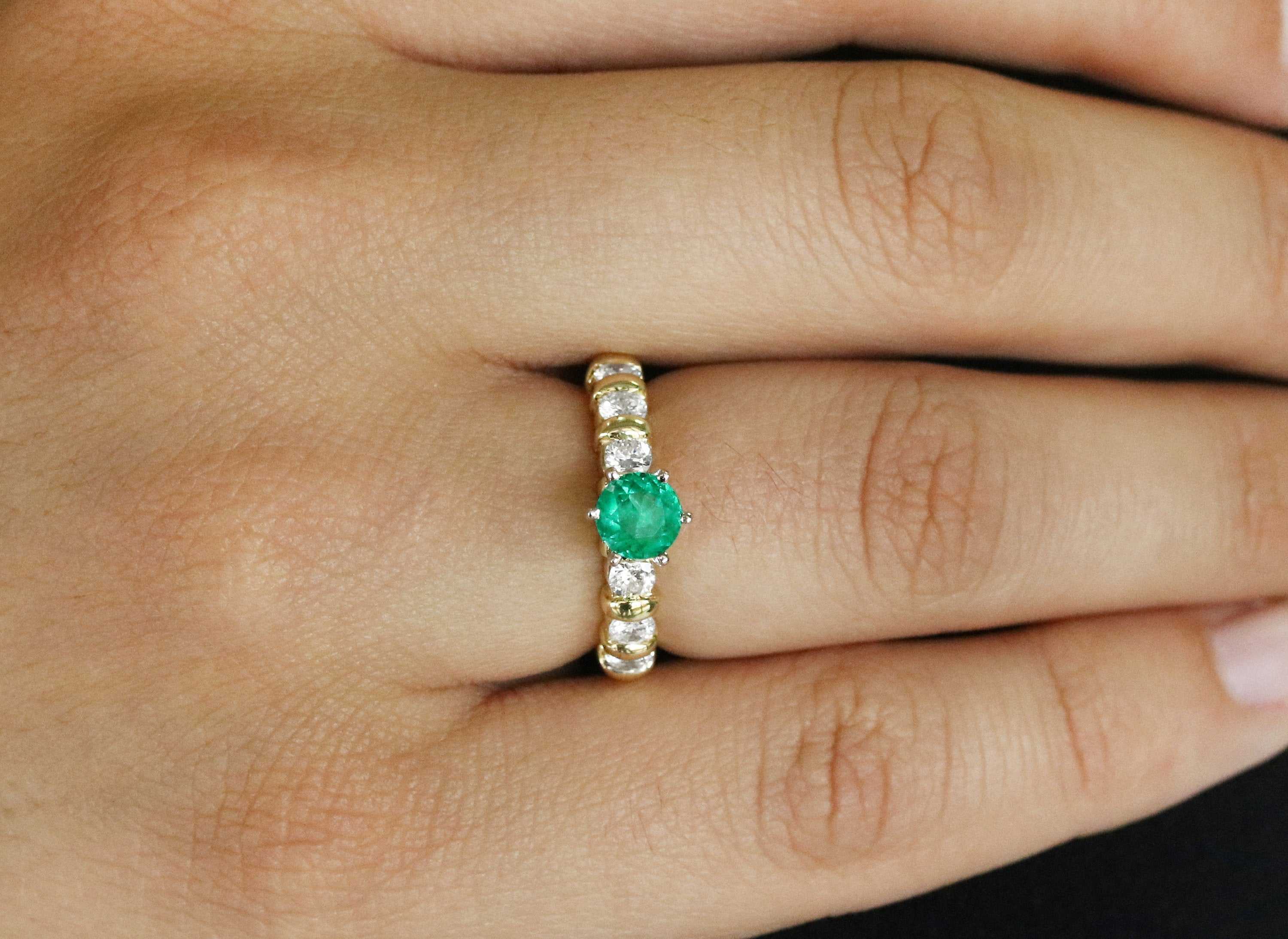 JR Colombian Emeralds 1.69tcw round emerald and diamond accent engagement ring in 18K yellow gold, showcasing intricate design.