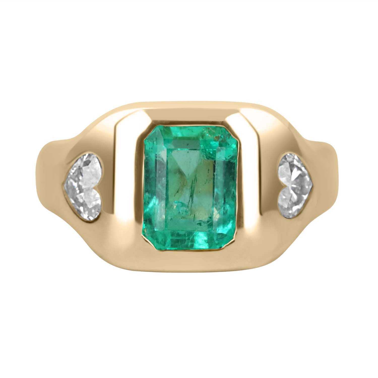 14K gold three stone gypsy ring with emerald cut Colombian emerald and heart-shaped diamonds