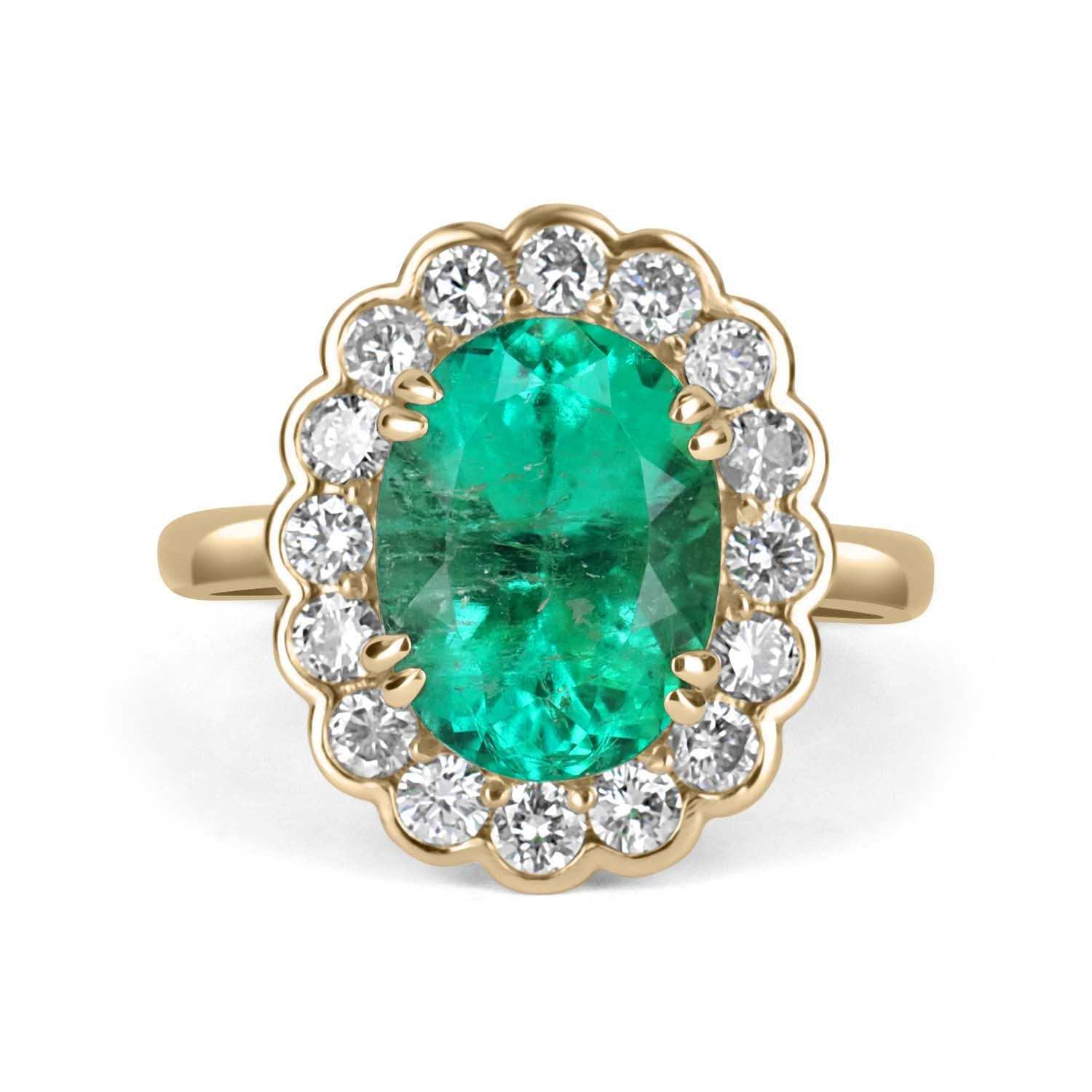 5.15tcw oval Colombian emerald ring with diamond halo set in 18K yellow gold