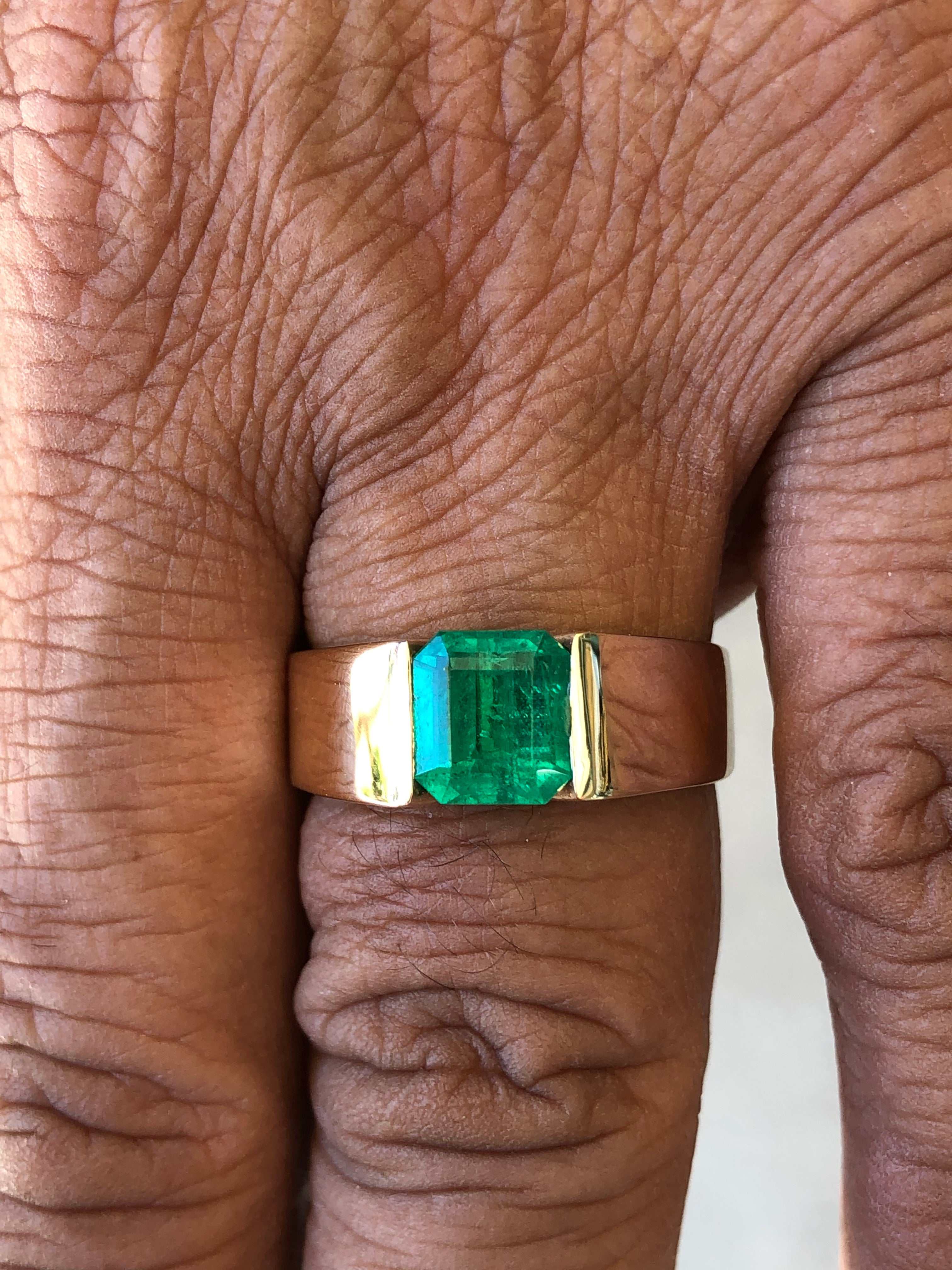 Yellow gold men's ring with a 2.0 carat emerald cut vivid green solitaire emerald from JR Colombian Emeralds.