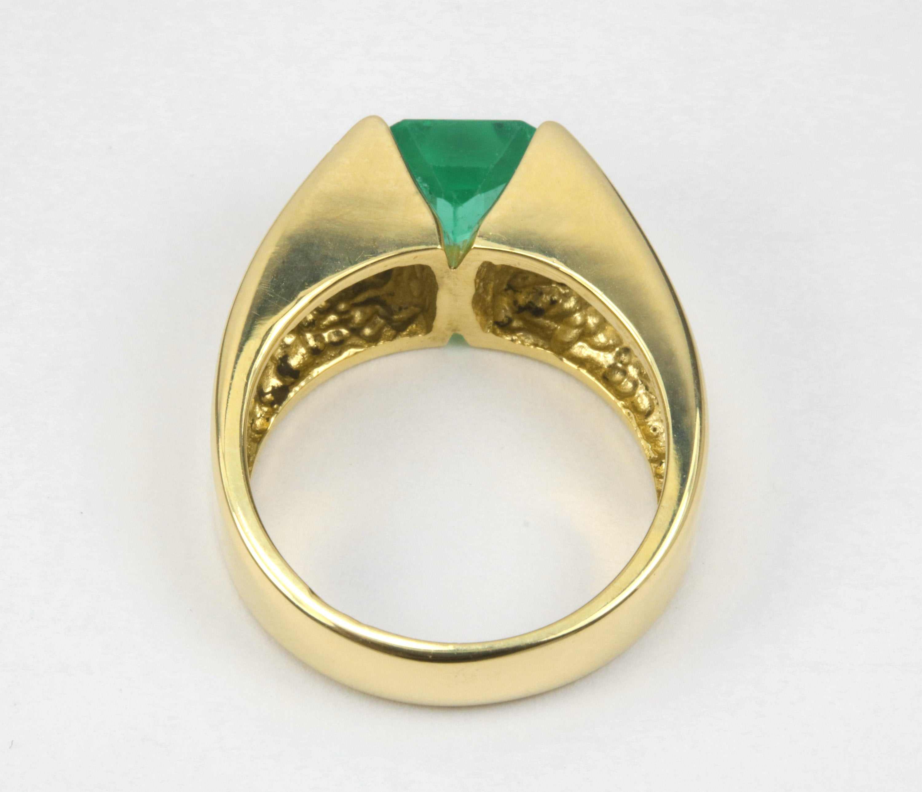 14K yellow gold men's ring with a 2.0 carat emerald cut vivid green solitaire emerald from JR Colombian Emeralds.