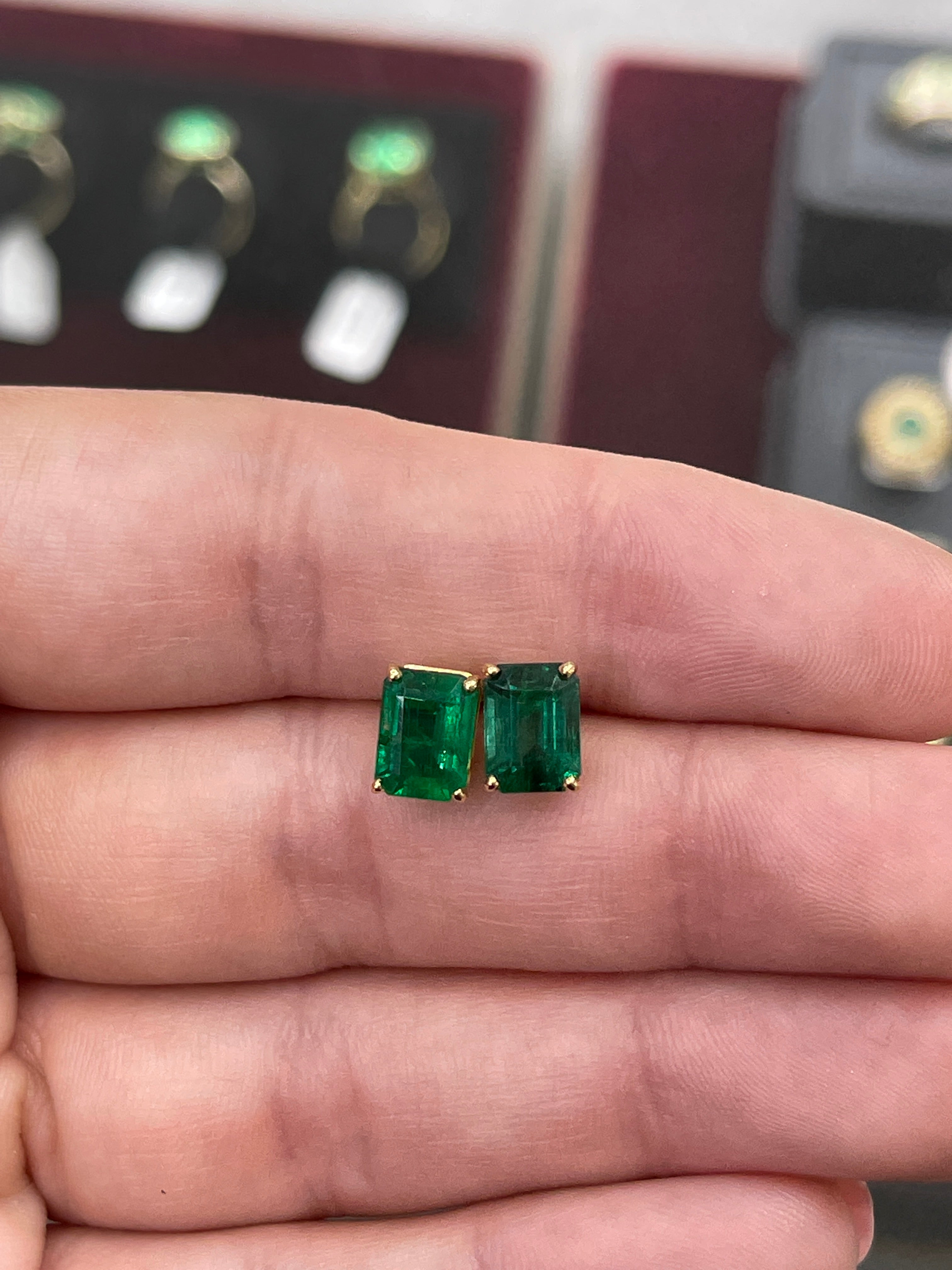 Vivid dark forest green AAA 5.0TCW emerald cut solitaire stud earrings in solid 18K gold by JR Colombian Emeralds.