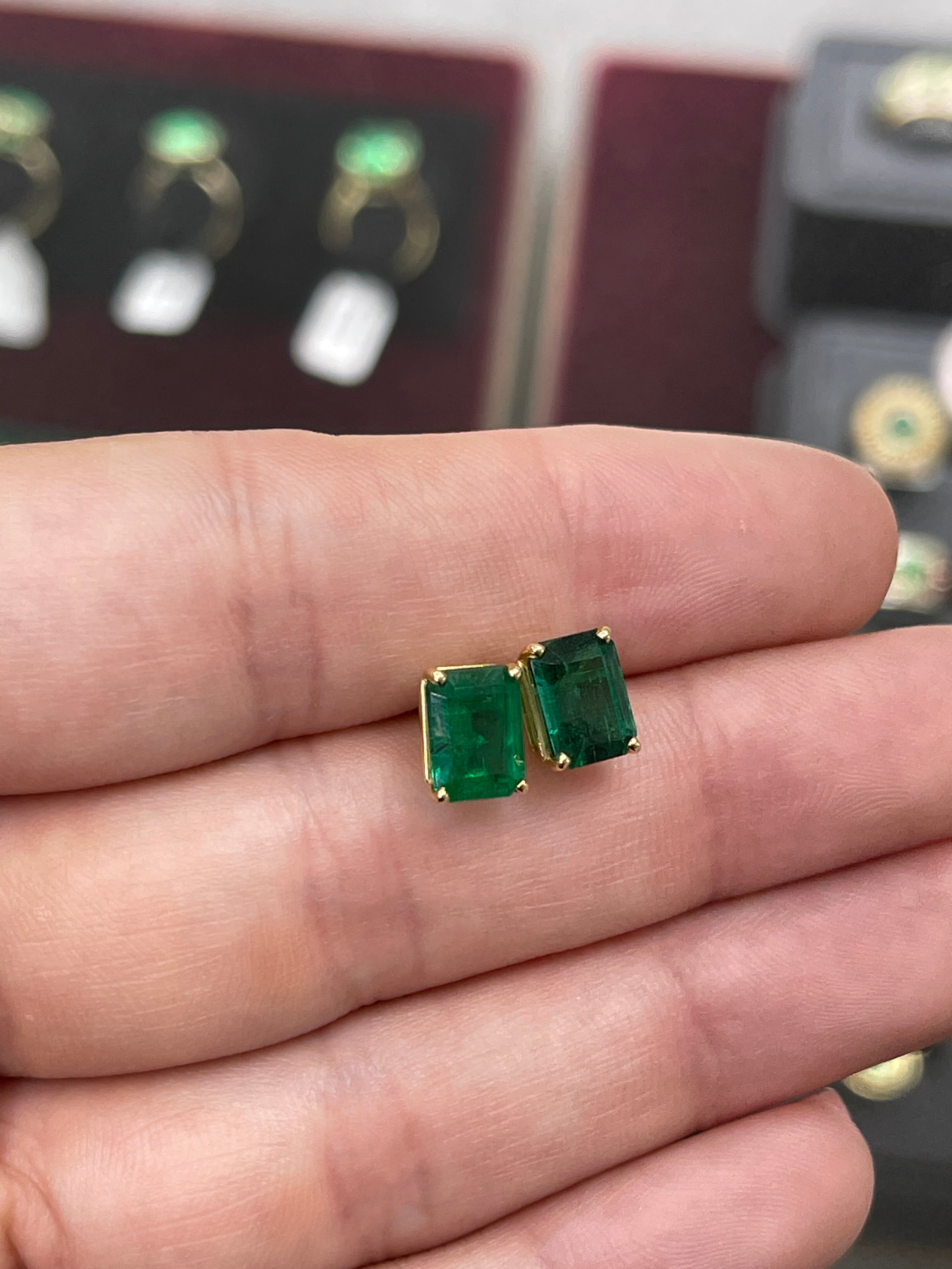 AAA 5.0TCW vivid dark forest green emerald cut solitaire studs in solid 18K gold by JR Colombian Emeralds.